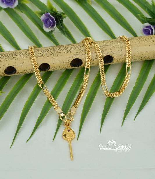 Gold plated Sahin chain with Murugan Vel pendant on bamboo flute and leaf background - queen galaxy collection