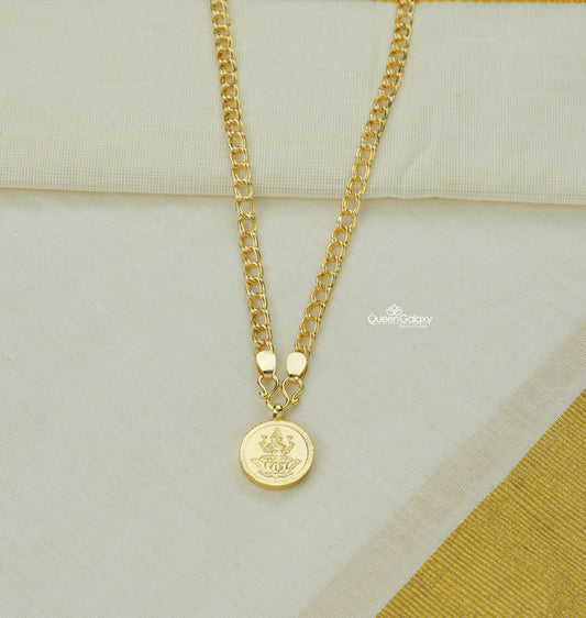 Gold plated chain with Lakshmi locket/pendant on off-white background – Queen Galaxy Collections