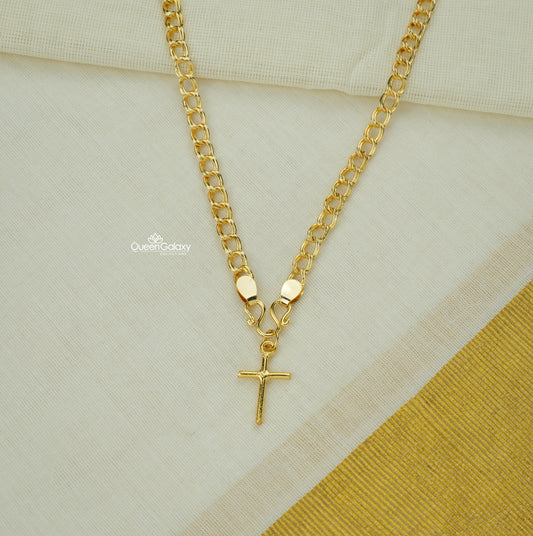 Goldplated chain with cross pendant on off-white fabric background - Queen Galaxy Collections