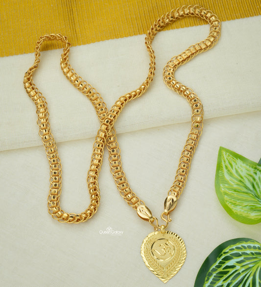 Bold Gold Plated Thali Chain for Women on a white surface with green leaves.
