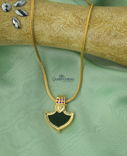 Gold plated Palakka pendant with green stone and violet accents on gold chain